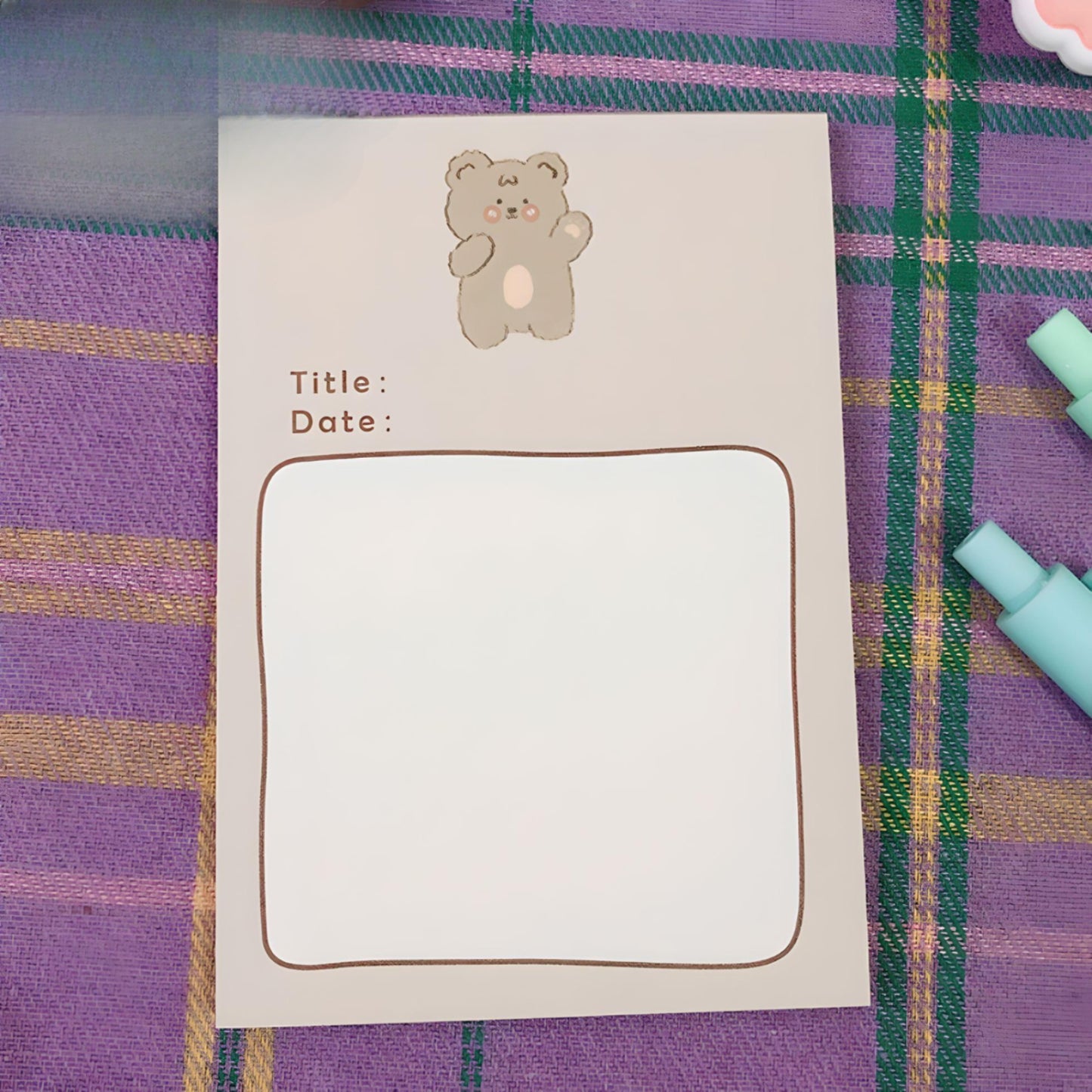 Kawaii bear sticky notes on a purple tablecloth