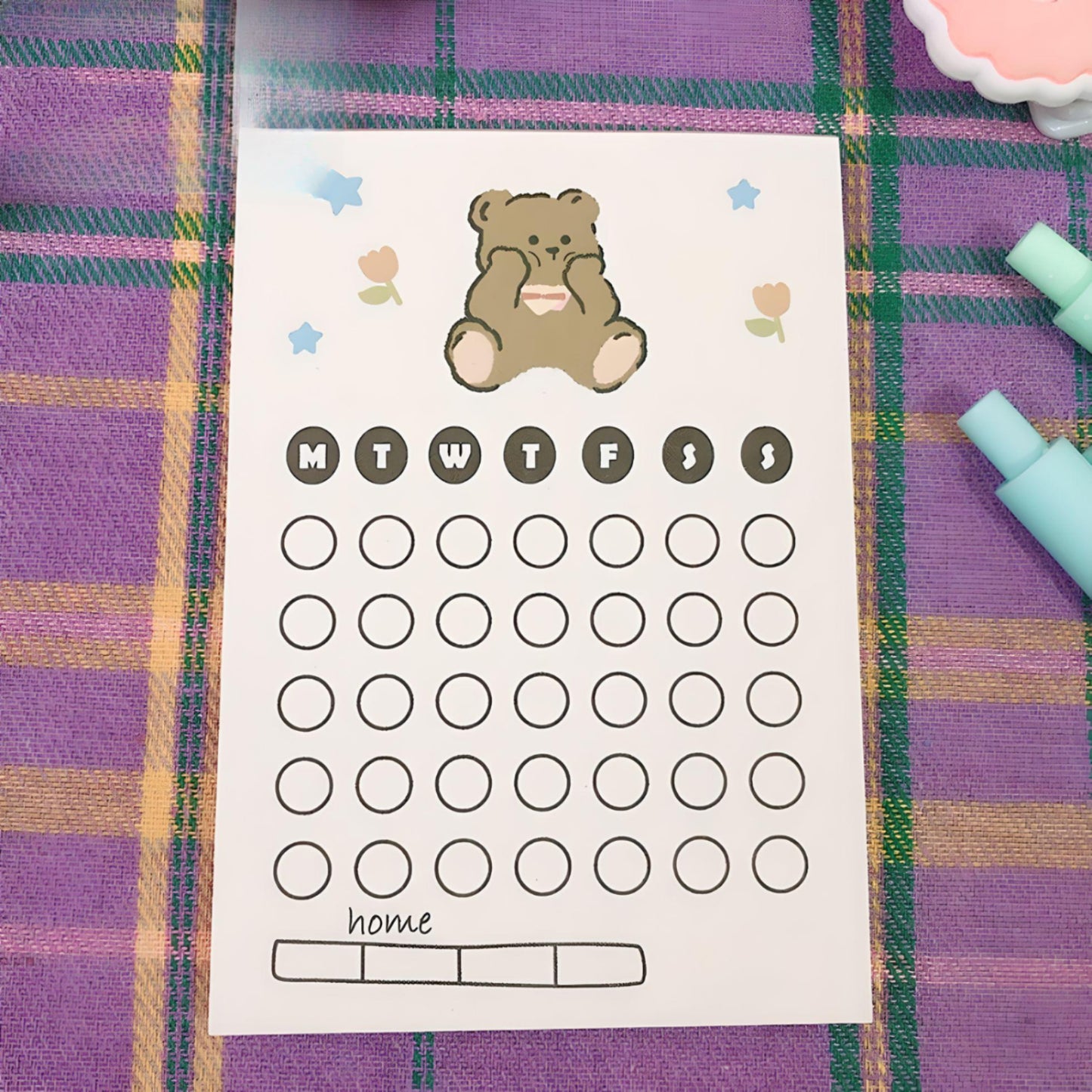 Kawaii bear sticky notes on a purple tablecloth