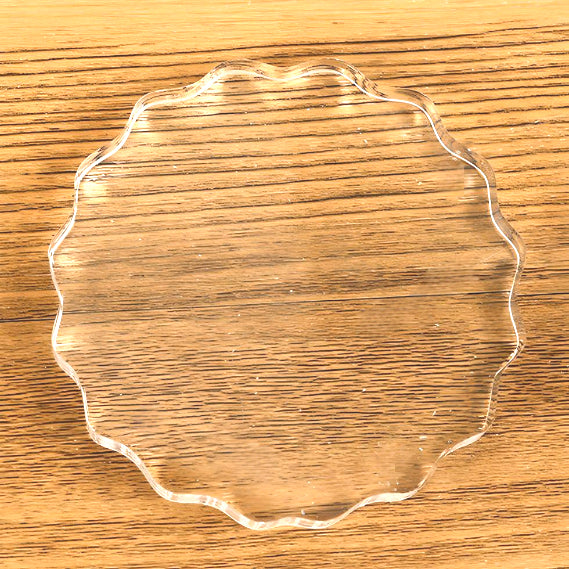 a round-shaped transparent acrylic stamp block