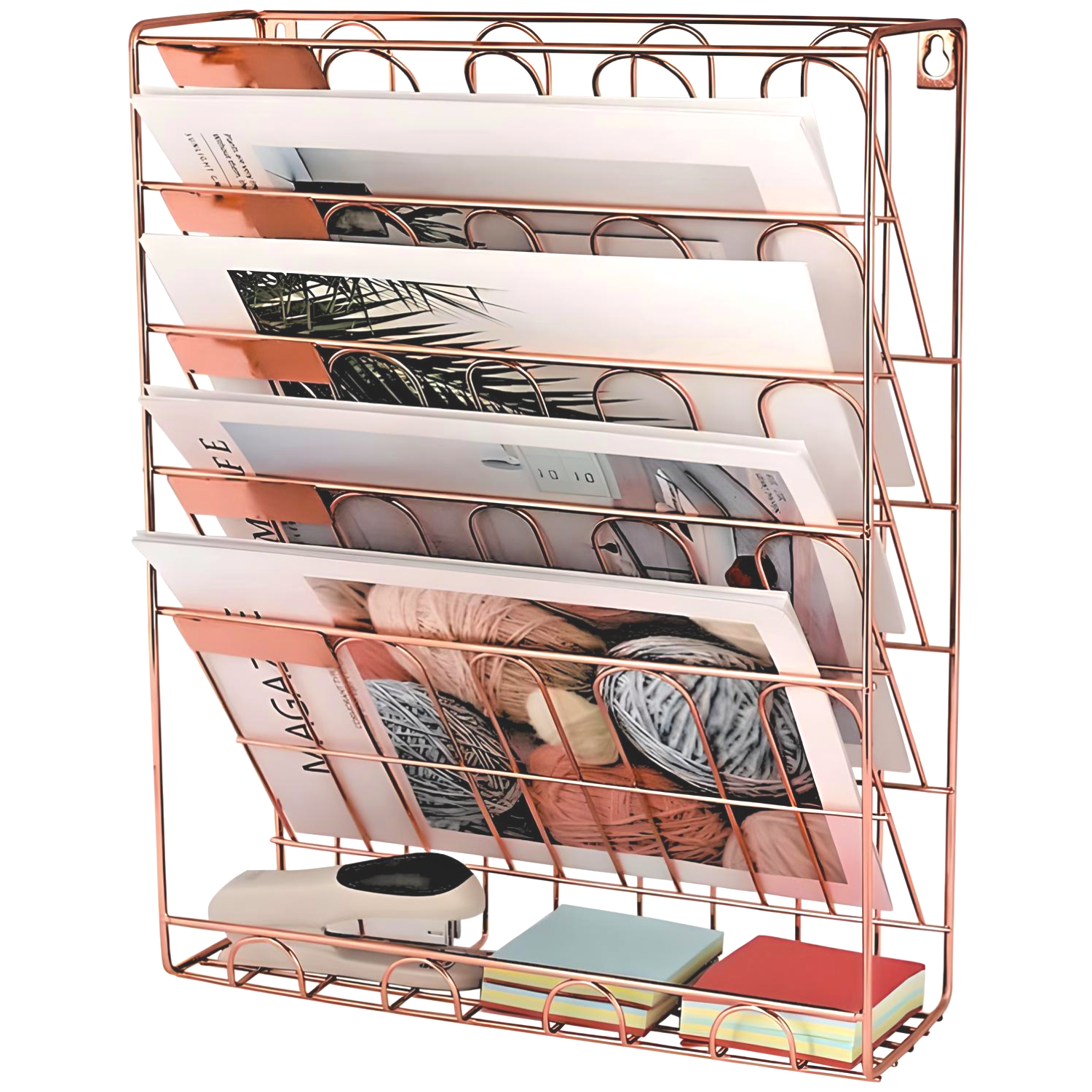 A copper wire wall file organizer with several magazines in it.
