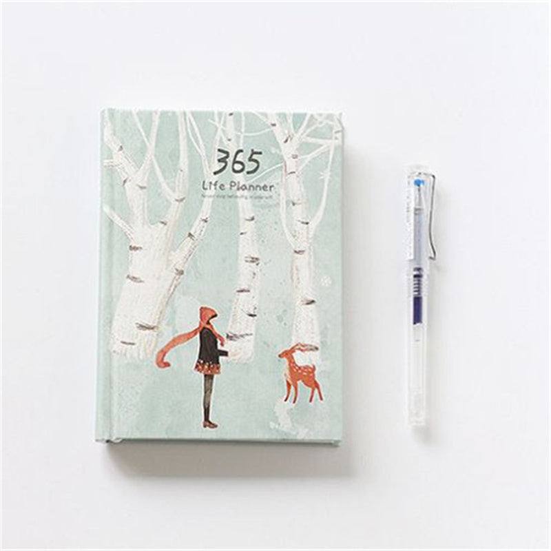 planner with an illustration of a woman feeding a deer