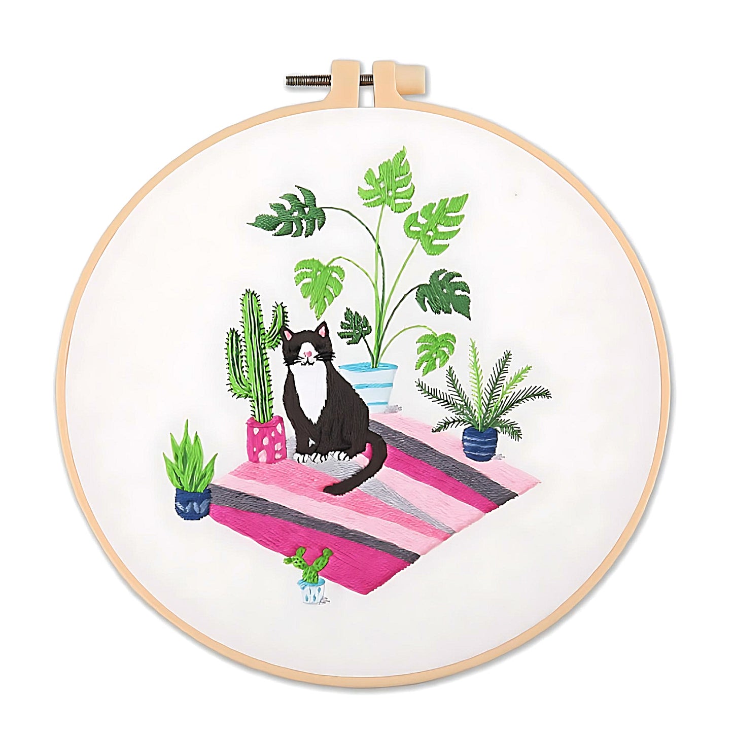 an embroidery of a black cat and plants
