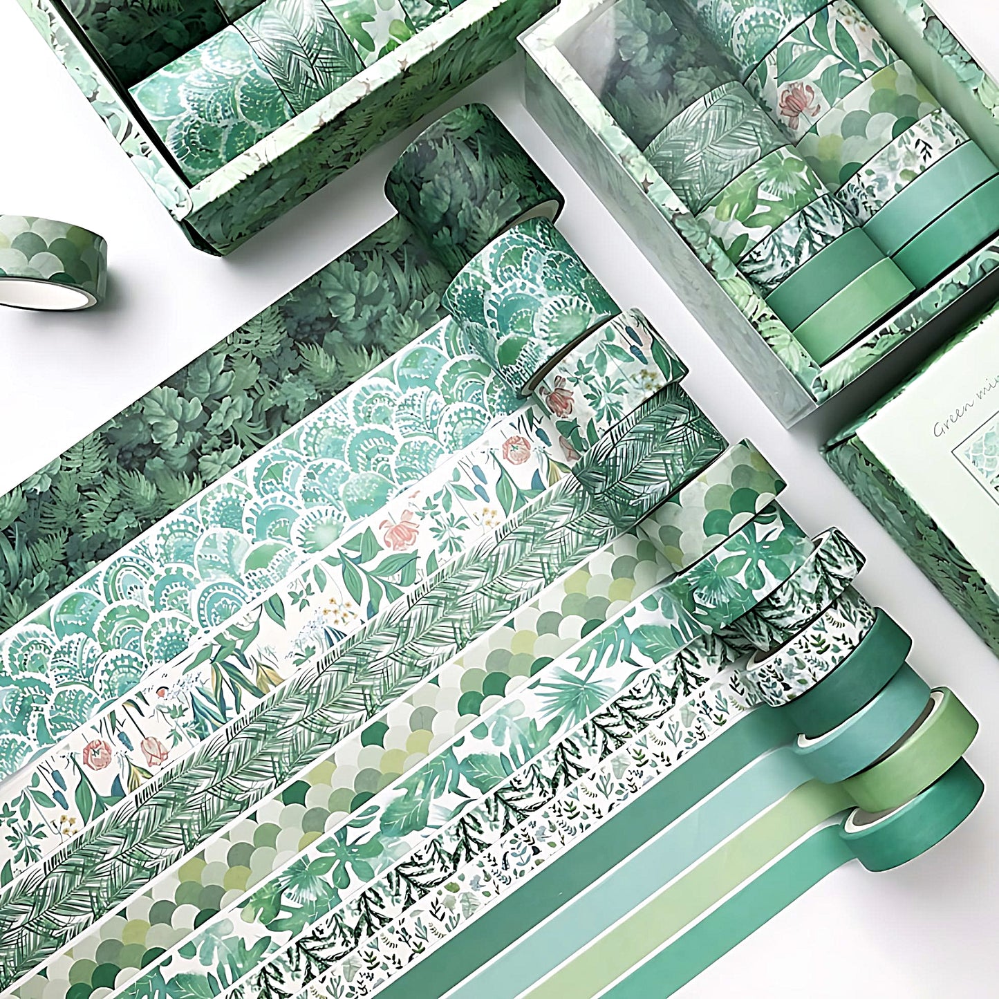 a colorful washi tape set in green colors on a white table