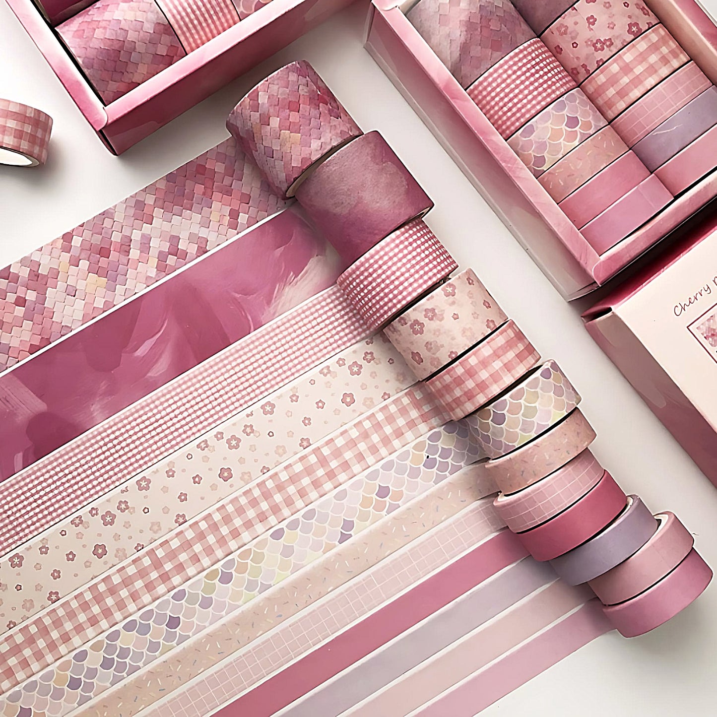a colorful washi tape set in pink colors on a white table