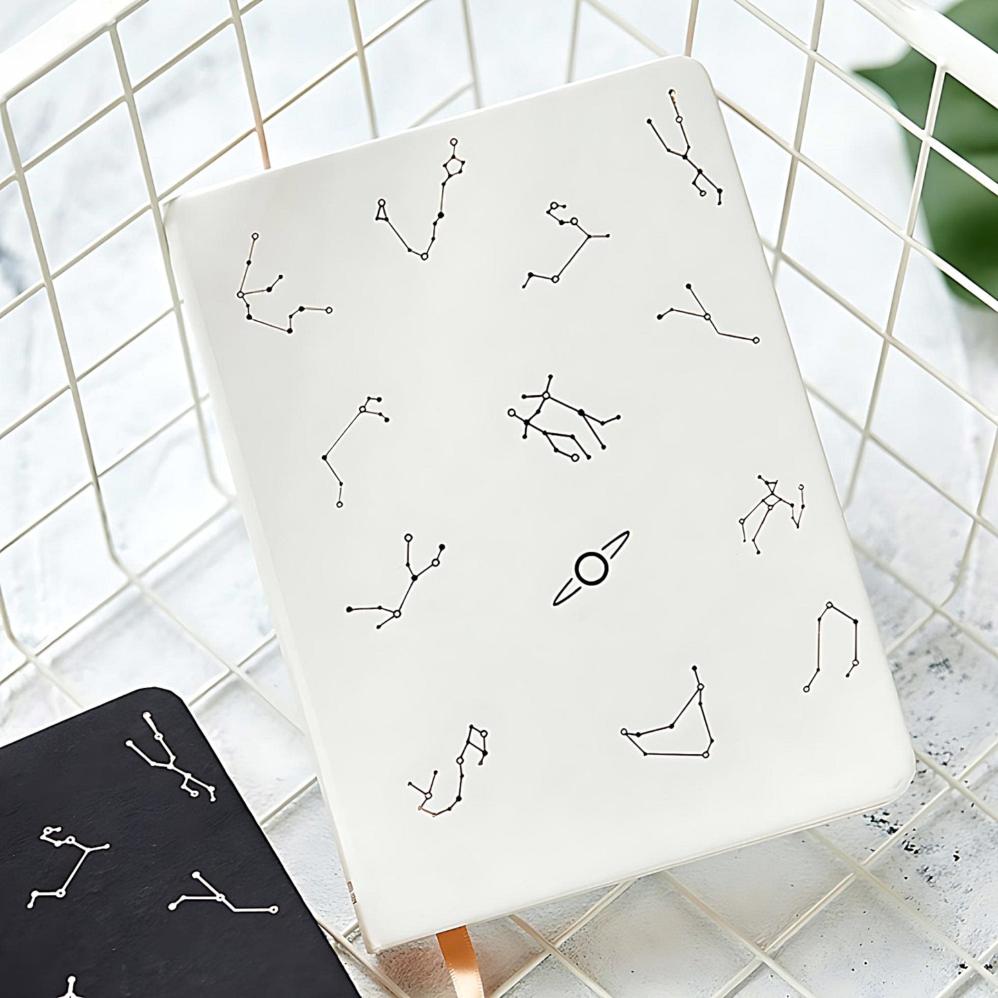 a white Constellation notebook in an organizer