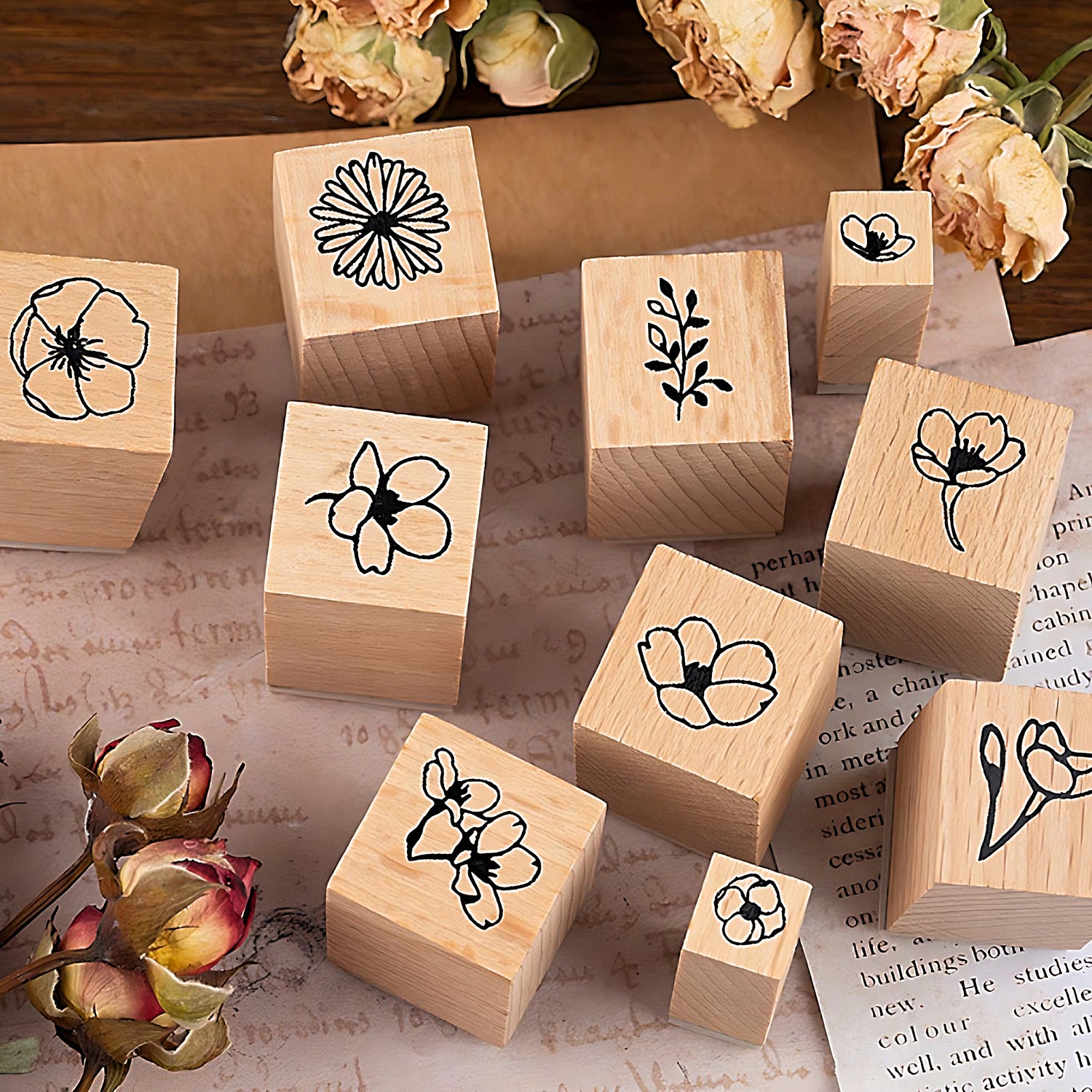 some floral stamps beside roses