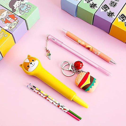 the content of a Kawaii Mystery Box: two pencils, three gel pens, and a keychain
