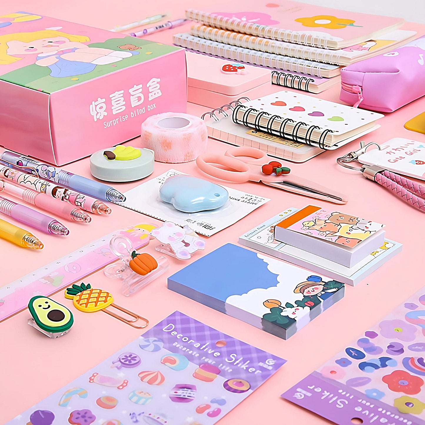 a pink Kawaii stationery blind box with the content besides, such as pens, sticky notes, scissors, ruler and notebooks