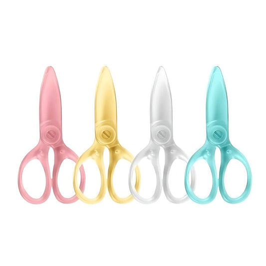 four Kokuyo plastic scissors in pink, yellow, transparent, and blue on a white background