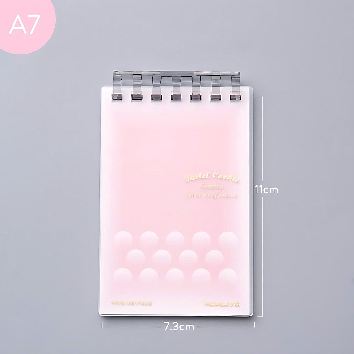 a pink Kokuyo Smart Ring memo pad on a grey background