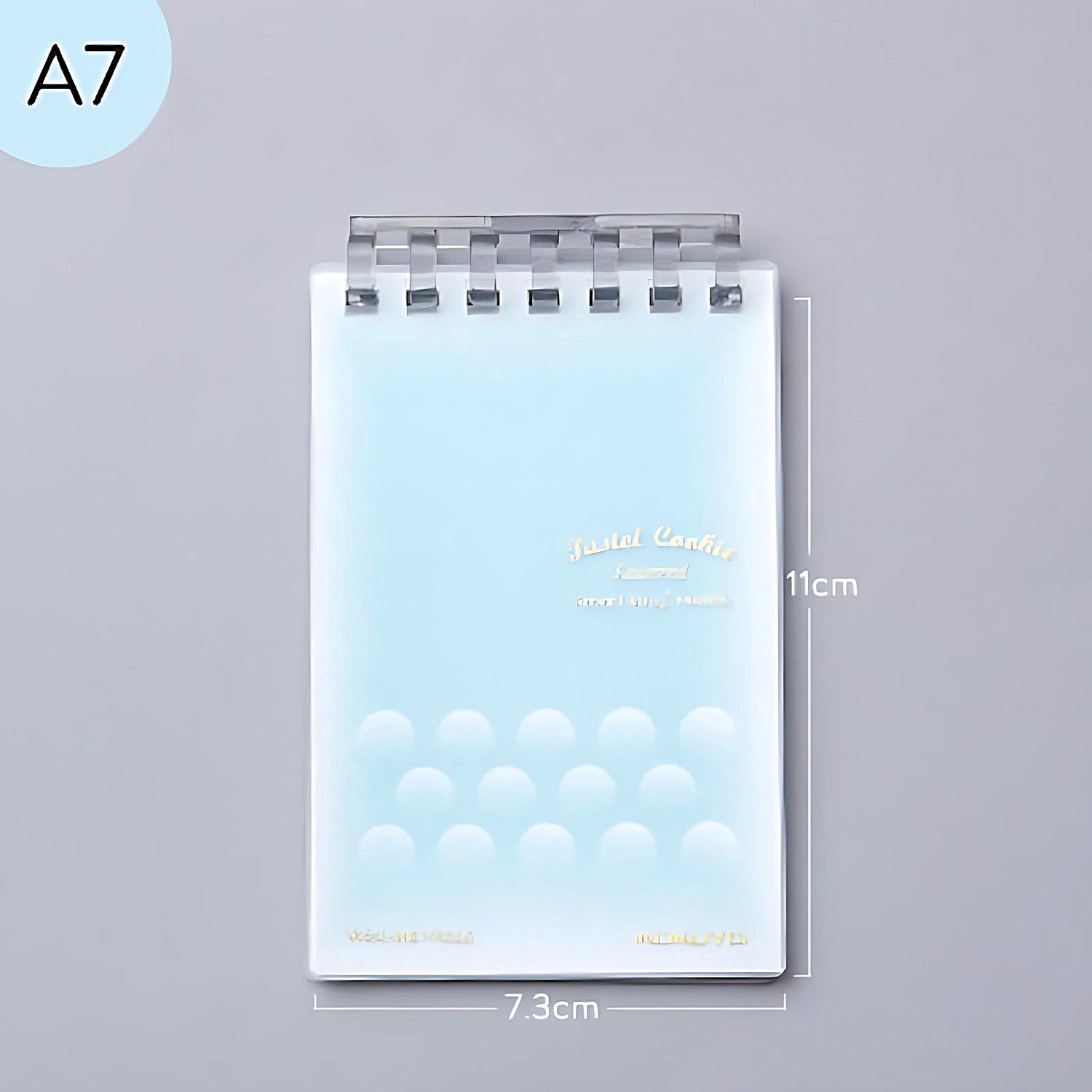 a blue Kokuyo Smart Ring memo pad on a grey background