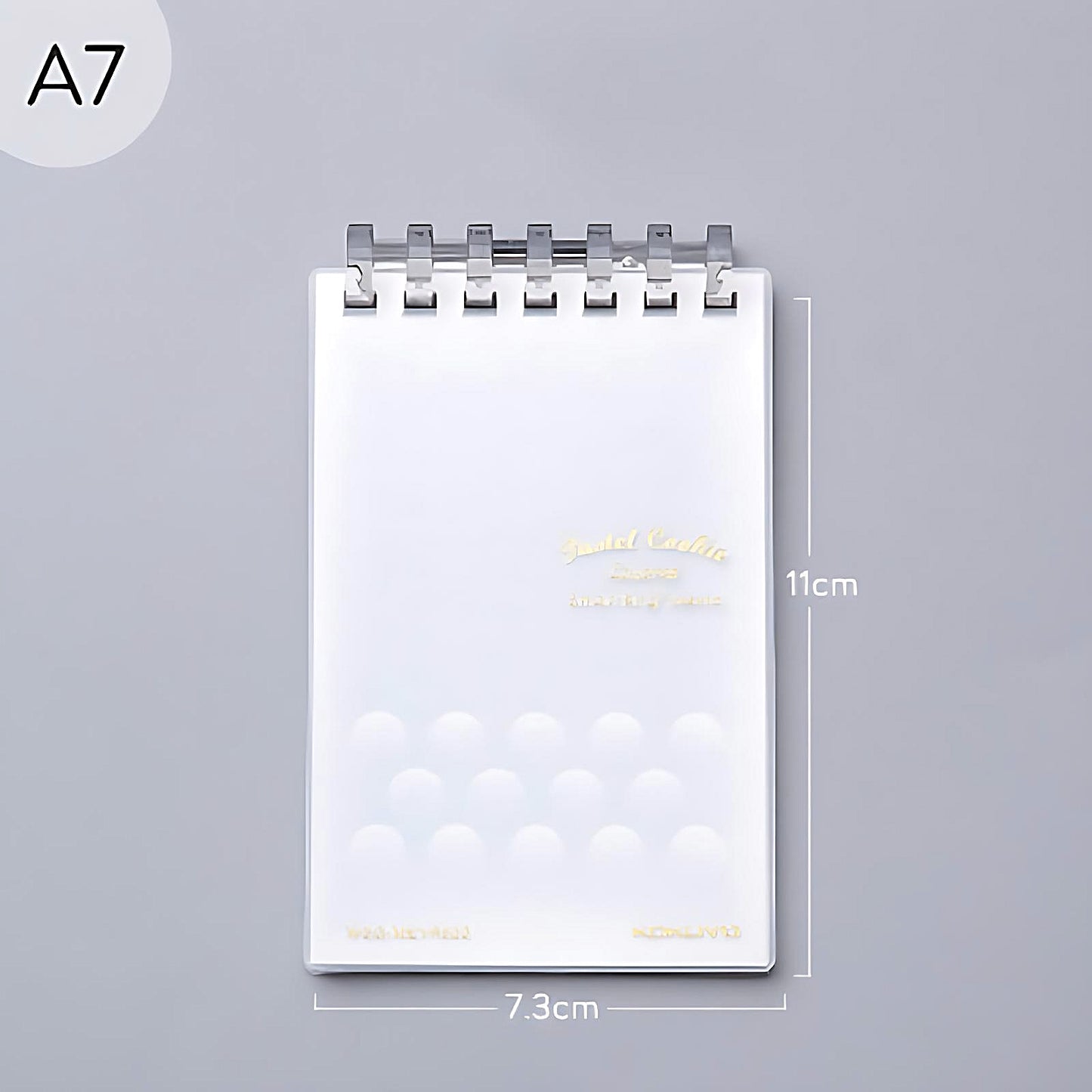 a transparent Kokuyo Smart Ring memo pad on a grey background
