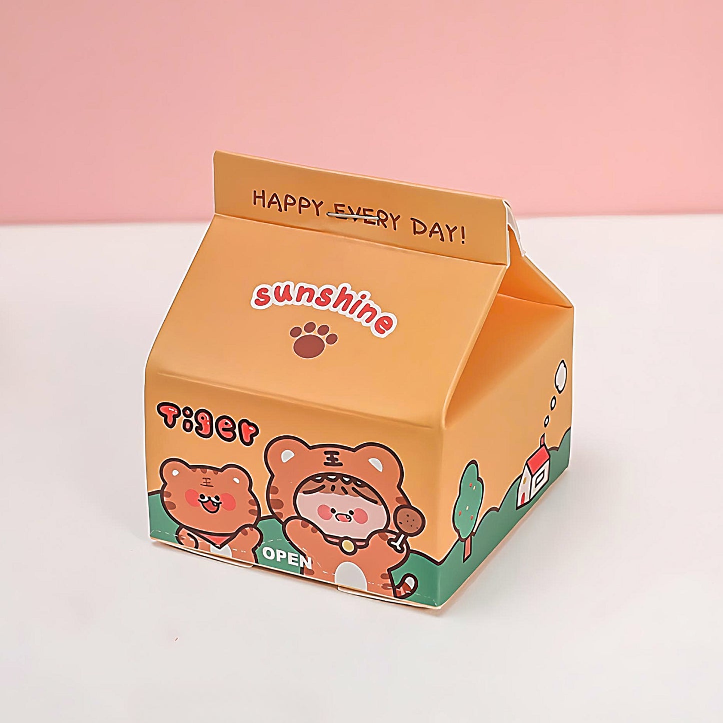 an orange Milk Carton sticky notes on a white table on in front of a pink background