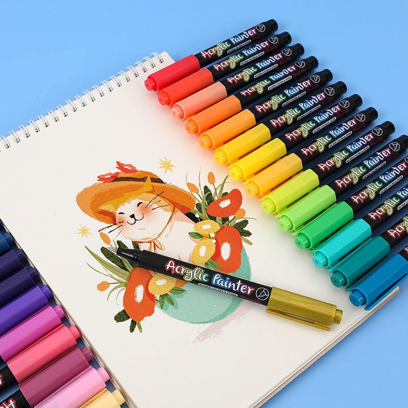a set of acrylic paint markers around a beautilful drawing