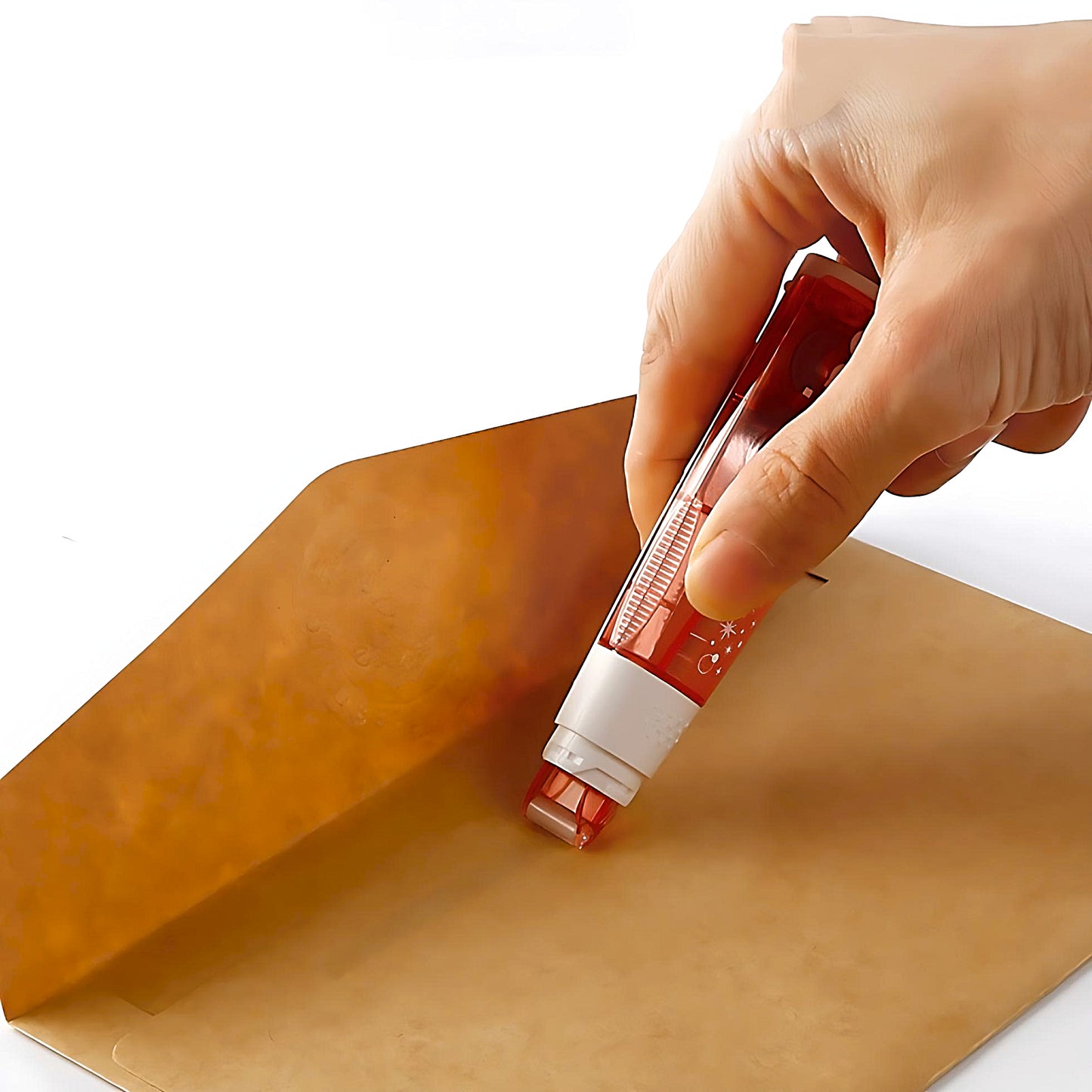 someone using the refillable adhesive roller Plus Norino to seal a brown envelope