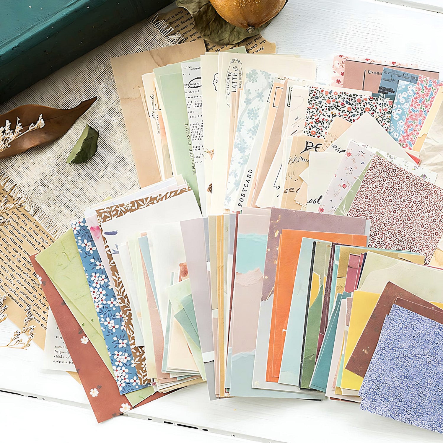 a stack of scrapbook paper on a table