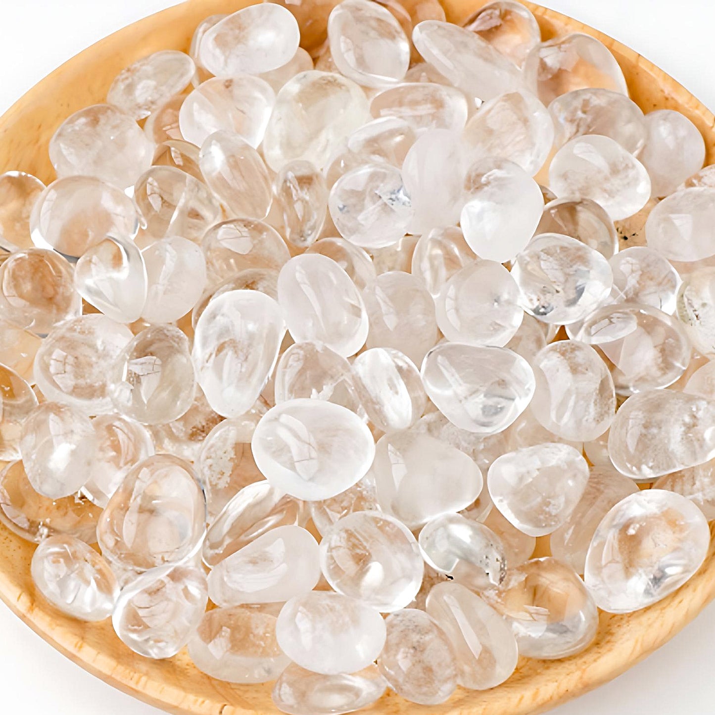 semi-precious tumbled stones in a bamboo bowl: clear quartz