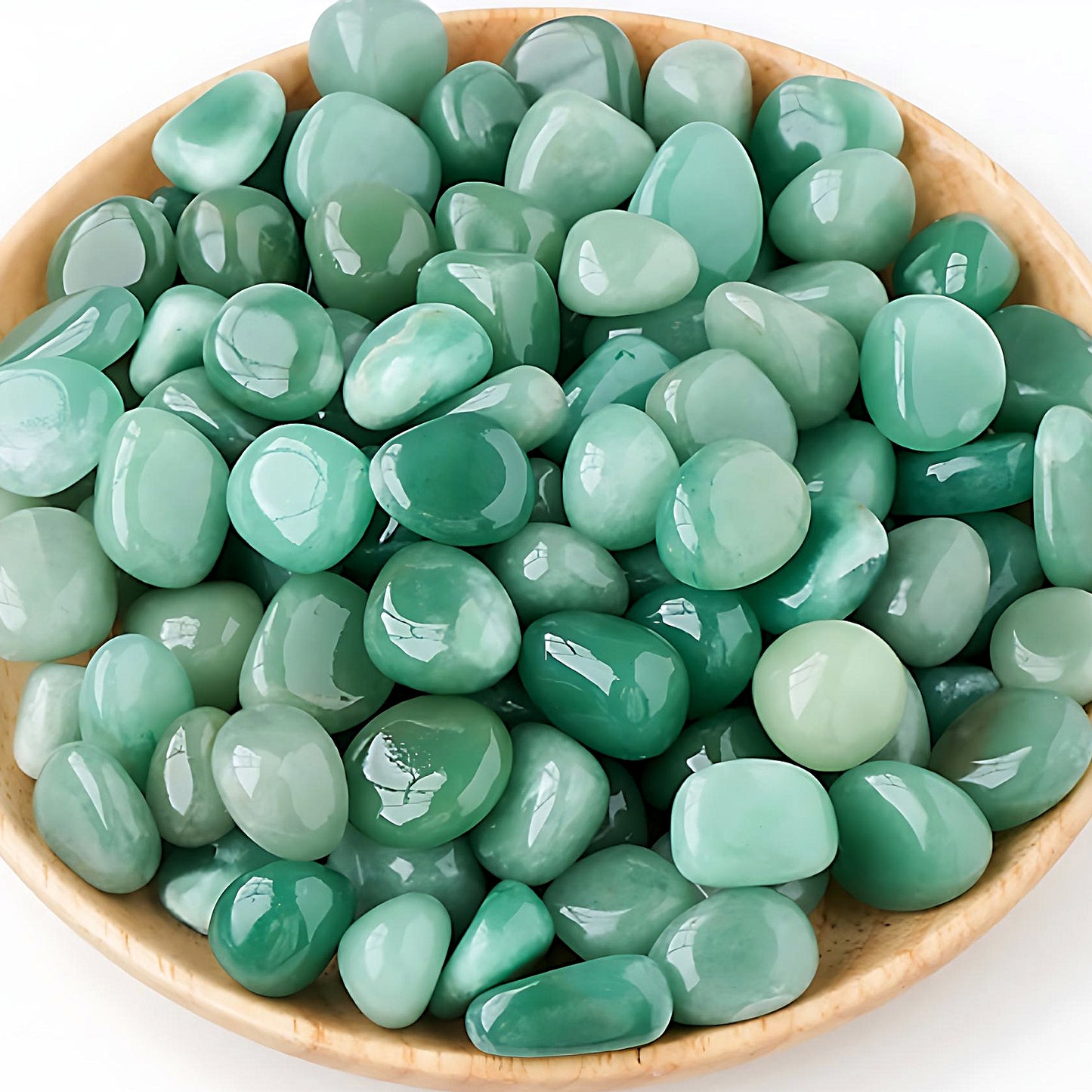 semi-precious tumbled stones in a bamboo bowl: green aventurine
