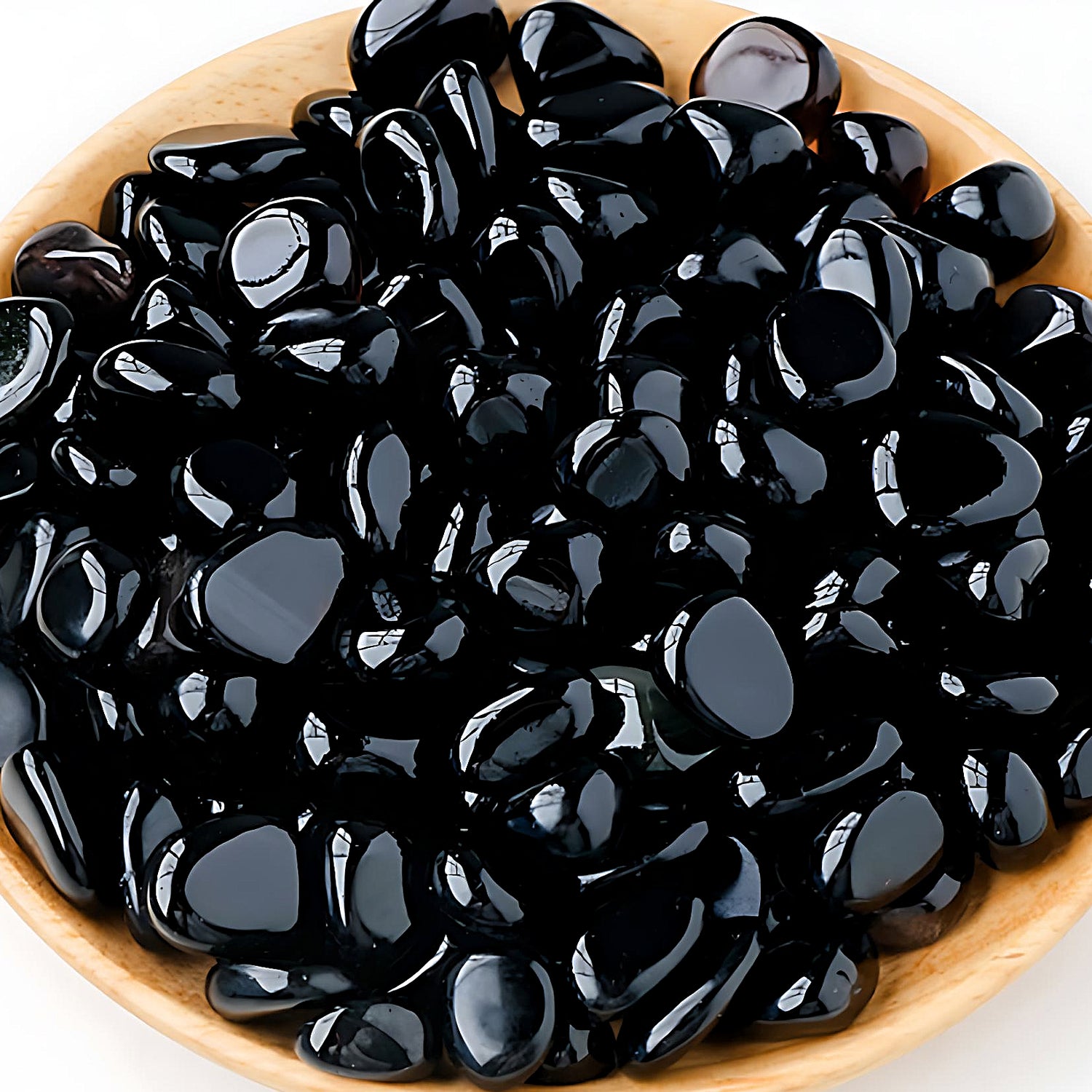 semi-precious tumbled stones in a bamboo bowl: obsidian