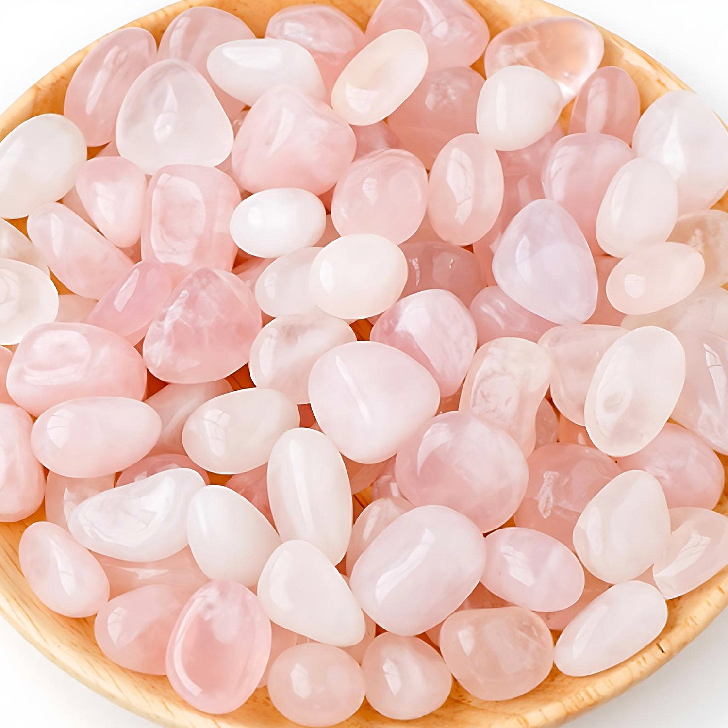 semi-precious tumbled stones in a bamboo bowl: pink quartz