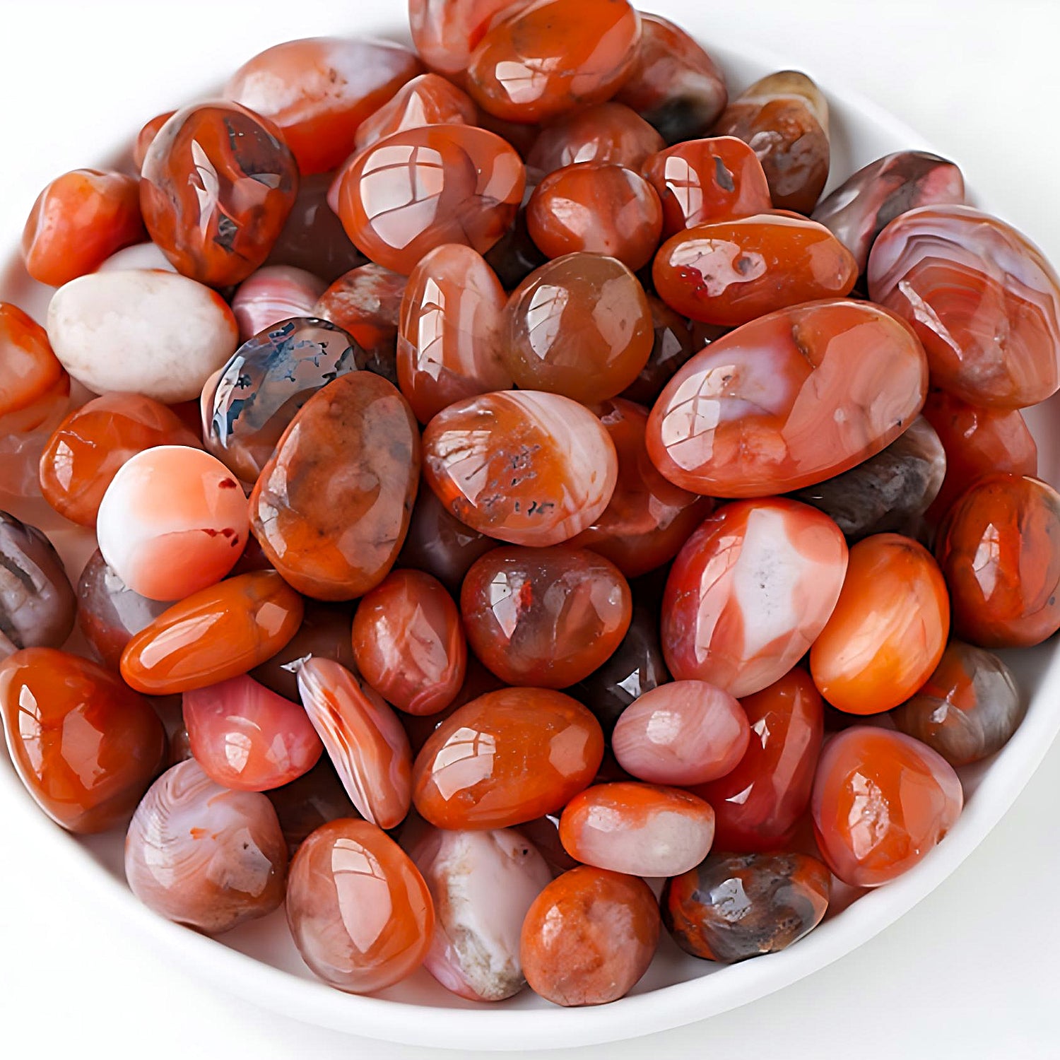 semi-precious tumbled stones in a bamboo bowl: red agate