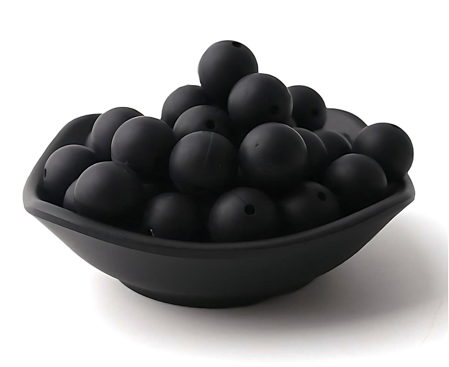 black silicone beads in a black bowl