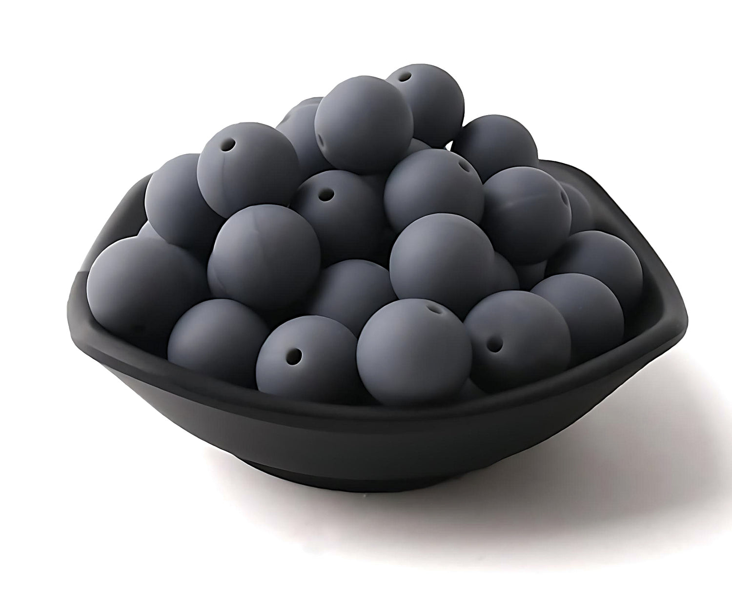 dark grey silicone beads in a black bowl