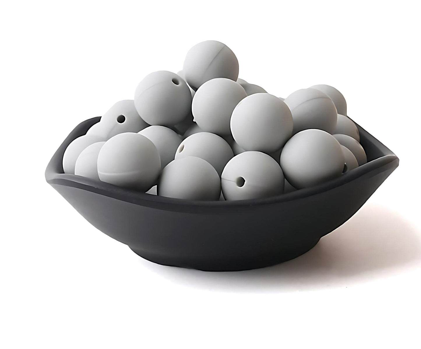 light grey silicone beads in a black bowl