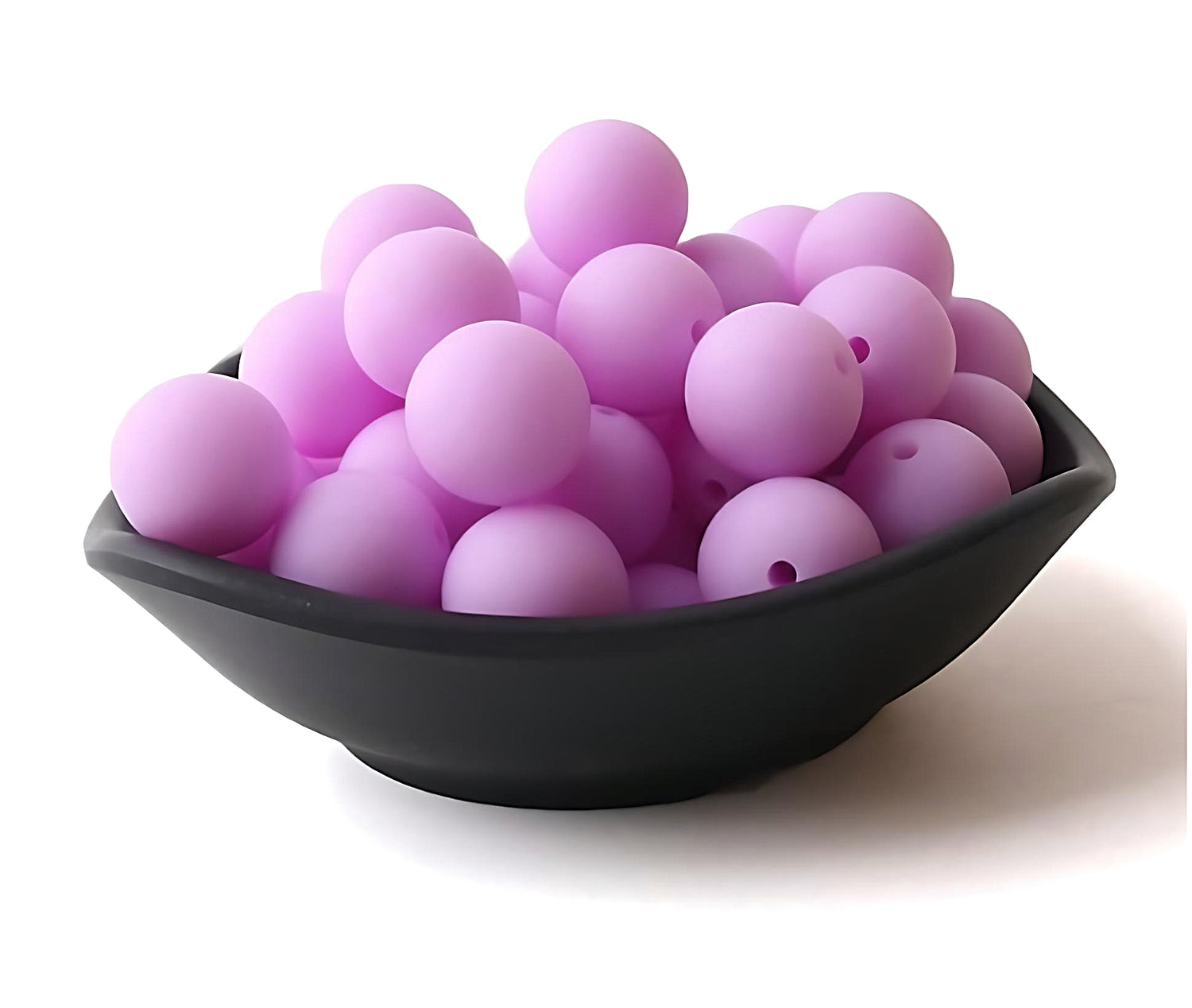 purple silicone beads in a black bowl