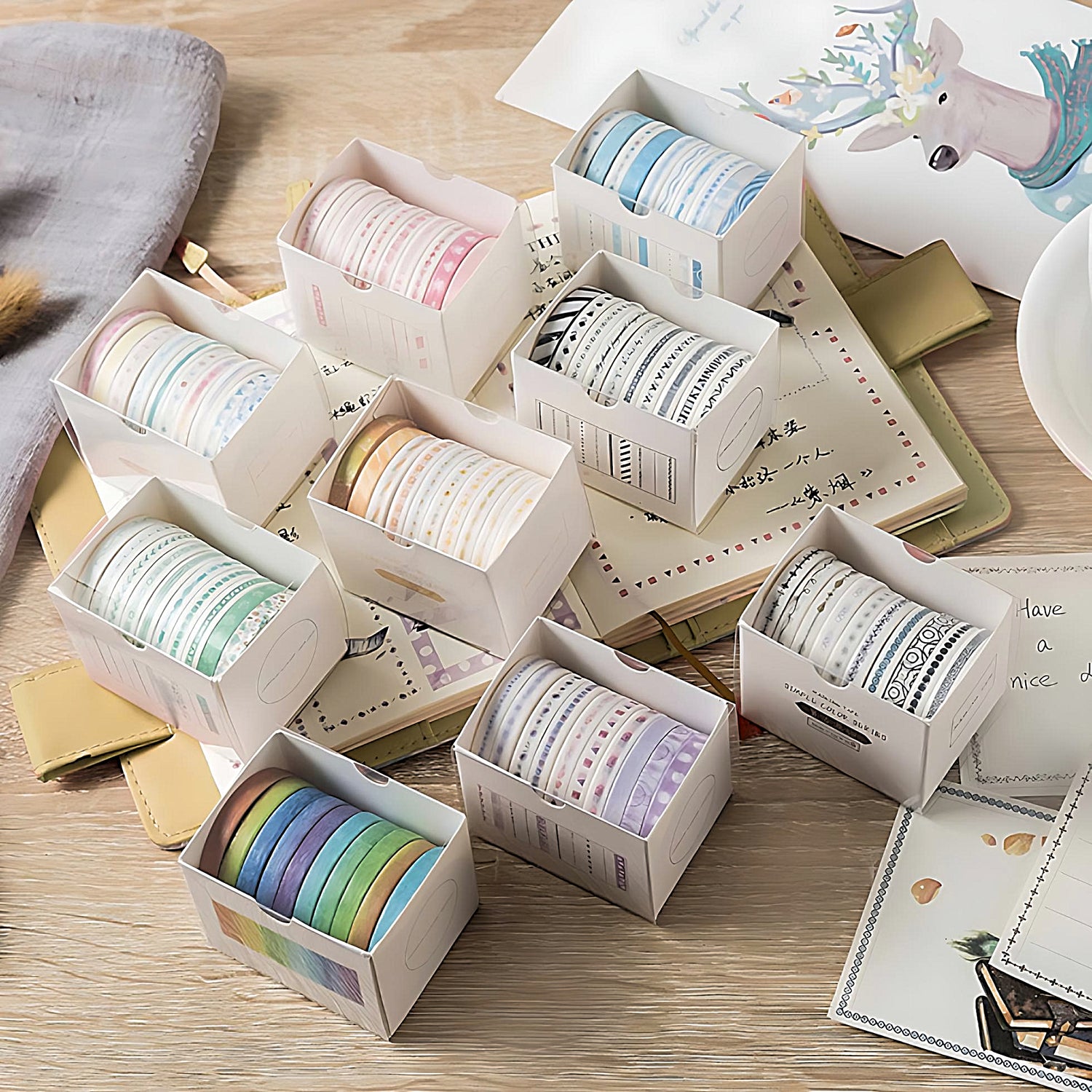 9 different thin washi tape sets on a wooden table