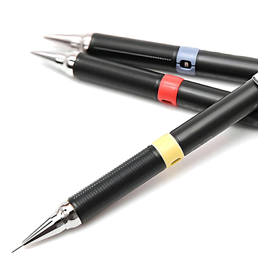 three Zebra Drafix mechanical pencils on a white background