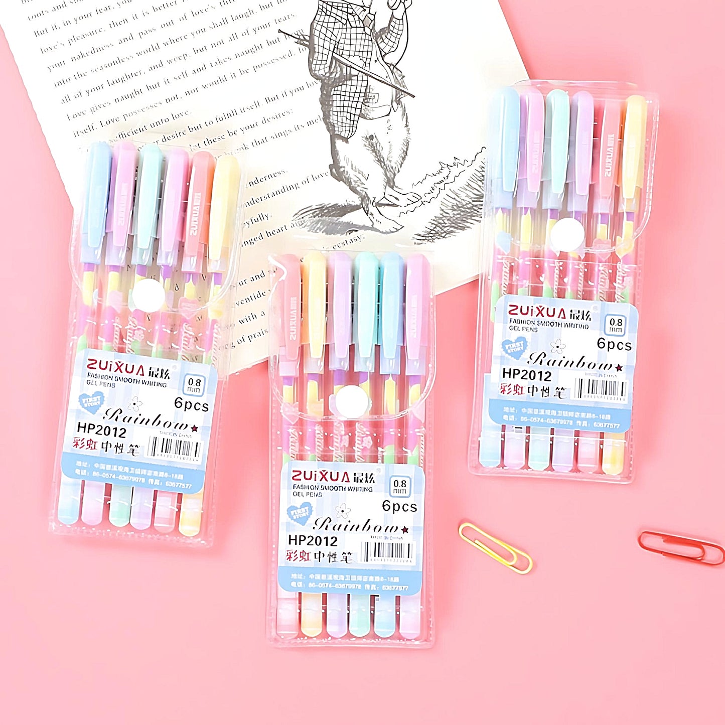three Zuixua rainbow gel pen sets on a pink background