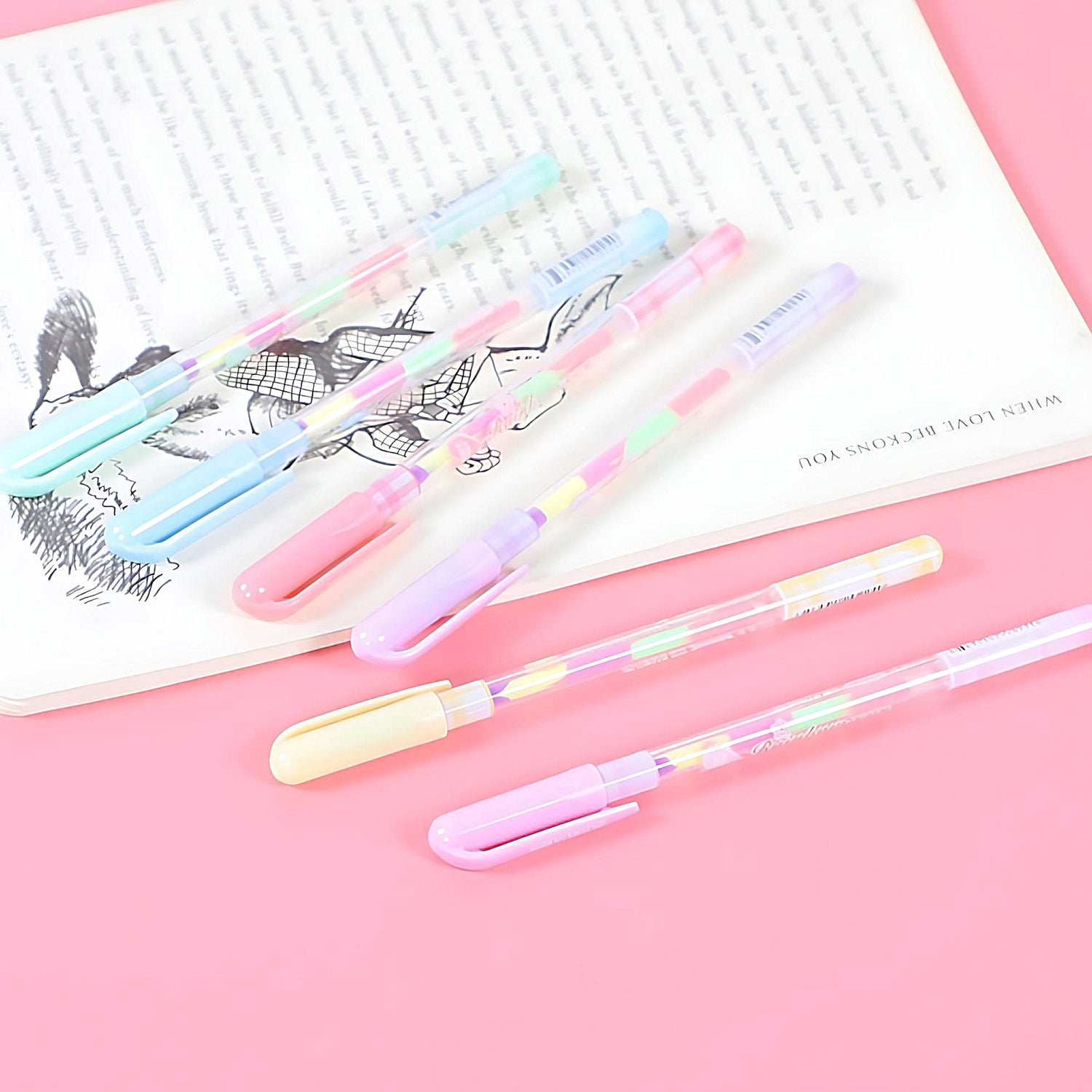 six Zuixua rainbow gel pens on a pink background