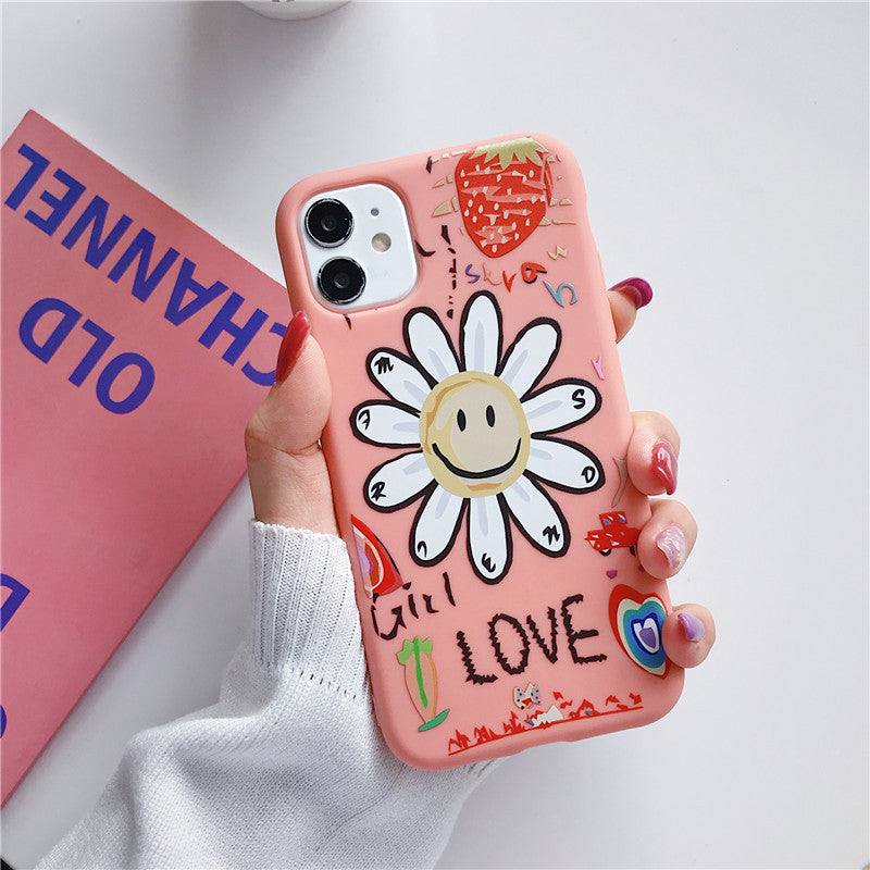 a woman holding an iPhone case with a Kawaii flower design on it