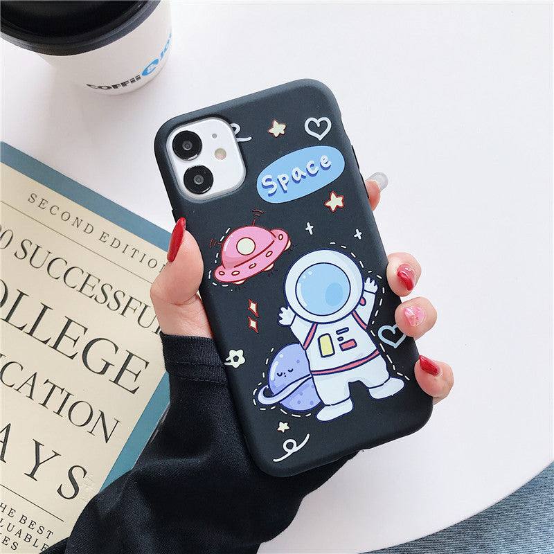 a woman holding an iPhone case with a Kawaii astronaut in space design on it